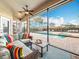 Relaxing screened lanai with cushioned seating area, perfect for enjoying the pool view at 278 Eaglet Way, Lake Mary, FL 32746