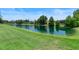 Tranquil view of the pond with lush green surroundings at 278 Eaglet Way, Lake Mary, FL 32746