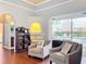 Cozy sitting area with built-in shelving and pool view at 278 Eaglet Way, Lake Mary, FL 32746
