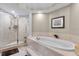 Bathroom with soaking tub and shower at 2901 S Atlantic Ave # 702, Daytona Beach, FL 32118