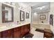 Double vanity bathroom with mirrors at 2901 S Atlantic Ave # 702, Daytona Beach, FL 32118