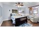 Serene bedroom featuring a ceiling fan and comfortable seating at 2901 S Atlantic Ave # 702, Daytona Beach, FL 32118
