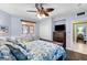 Spacious bedroom with a ceiling fan and ocean-themed bedding at 2901 S Atlantic Ave # 702, Daytona Beach, FL 32118