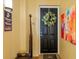 Welcoming entryway with unique decor and a black front door at 2901 S Atlantic Ave # 702, Daytona Beach, FL 32118
