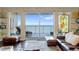 Cozy living room featuring ocean views, comfortable seating, and ample natural light at 2901 S Atlantic Ave # 702, Daytona Beach, FL 32118