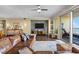 Spacious living room with leather sofas, hardwood floors, and ocean views at 2901 S Atlantic Ave # 702, Daytona Beach, FL 32118