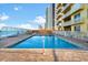 Inviting heated swimming pool with ample deck space for lounging at 2901 S Atlantic Ave # 702, Daytona Beach, FL 32118