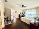 Spacious bedroom with dark hardwood floors and ceiling fan at 3351 Whitestone Cir # 302, Kissimmee, FL 34741