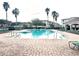 Refreshing community pool with numerous lounge chairs at 3351 Whitestone Cir # 302, Kissimmee, FL 34741