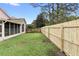 Backyard with wooden fence and grassy lawn at 3413 Foxcroft Cir, Oviedo, FL 32765