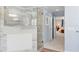 Walk-in shower with marble tile and glass door at 346 Calliope St, Ocoee, FL 34761