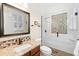Bathroom with granite vanity and hexagon tile shower at 346 Calliope St, Ocoee, FL 34761