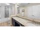 Elegant bathroom with double vanity and a large mirror at 346 Calliope St, Ocoee, FL 34761