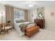 Charming bedroom with a wooden dresser and large window at 346 Calliope St, Ocoee, FL 34761