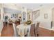 Formal dining room adjacent to living room with hardwood floors at 346 Calliope St, Ocoee, FL 34761