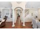 Elegant hallway with hardwood floors and columns at 346 Calliope St, Ocoee, FL 34761