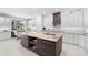Spacious kitchen with large island, granite countertops, and white cabinetry at 346 Calliope St, Ocoee, FL 34761