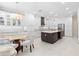 Gourmet kitchen with large island, stainless steel appliances, and white cabinetry at 346 Calliope St, Ocoee, FL 34761