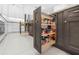 Modern kitchen with pull-out spice rack and ample storage at 346 Calliope St, Ocoee, FL 34761
