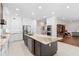 Modern kitchen with large island, stainless steel appliances, and granite countertops at 346 Calliope St, Ocoee, FL 34761