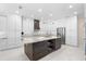 Modern kitchen featuring granite island and stainless steel appliances at 346 Calliope St, Ocoee, FL 34761