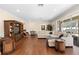 Spacious living room with hardwood floors, large sectional sofa, and access to backyard at 346 Calliope St, Ocoee, FL 34761