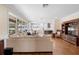 Open concept living room with views of kitchen and access to backyard at 346 Calliope St, Ocoee, FL 34761