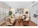 Sitting area with hardwood floors, wicker chairs, and a globe at 346 Calliope St, Ocoee, FL 34761