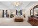 Spacious main bedroom with a king-size bed and dresser at 346 Calliope St, Ocoee, FL 34761