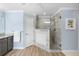 Updated walk in shower with glass enclosure and marble tile at 346 Calliope St, Ocoee, FL 34761