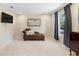 Relaxing sitting room with chaise lounge and large TV at 346 Calliope St, Ocoee, FL 34761