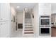 Elegant staircase with wood treads and white risers at 346 Calliope St, Ocoee, FL 34761
