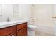 Well-lit bathroom features a sink vanity, toilet, and shower/tub combo at 36502 Barrington Dr, Eustis, FL 32736