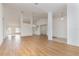 Spacious open concept living room with wood floors and lots of natural light at 36502 Barrington Dr, Eustis, FL 32736