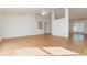 Open living room with vaulted ceilings, ceiling fan, wood floors, and natural light at 36502 Barrington Dr, Eustis, FL 32736