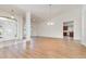 Spacious open concept living room with wood floors and lots of natural light at 36502 Barrington Dr, Eustis, FL 32736