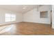 Open living room with vaulted ceilings, fan and natural light from the window at 36502 Barrington Dr, Eustis, FL 32736