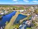 Aerial view of neighborhood with pond and houses at 388 Westwind Ct, Lake Mary, FL 32746