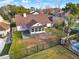 Aerial view showcasing the home's backyard, pool, and surrounding landscape at 388 Westwind Ct, Lake Mary, FL 32746