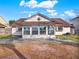 Home features a large sunroom and backyard at 388 Westwind Ct, Lake Mary, FL 32746