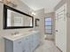 Bathroom with double vanity and large mirror at 388 Westwind Ct, Lake Mary, FL 32746