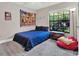 Cozy bedroom with plush carpet and large window at 388 Westwind Ct, Lake Mary, FL 32746