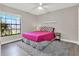 Bedroom with grey carpet and large window at 388 Westwind Ct, Lake Mary, FL 32746