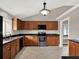 Kitchen with wood cabinets, granite countertops, and stainless steel appliances at 388 Westwind Ct, Lake Mary, FL 32746