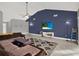 Living room with sectional sofa and an accent wall at 388 Westwind Ct, Lake Mary, FL 32746
