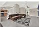 Living room with a sectional sofa and a view of the kitchen at 388 Westwind Ct, Lake Mary, FL 32746