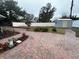 Landscaped backyard with storage shed and brick pavers at 4010 Winderlakes Dr, Orlando, FL 32835