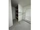 Unfinished basement area with shelving for storage at 4010 Winderlakes Dr, Orlando, FL 32835