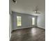Spacious bedroom with wood-look floors and large windows at 4010 Winderlakes Dr, Orlando, FL 32835
