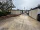Long driveway leads to a gated entrance with brickwork at 4010 Winderlakes Dr, Orlando, FL 32835